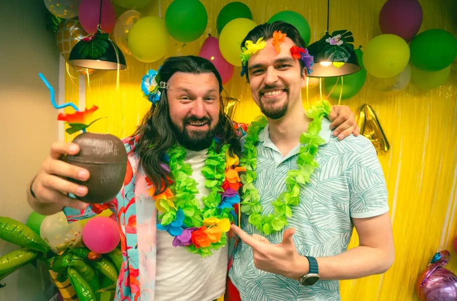 Two teammates at a Hawaiian-themed party