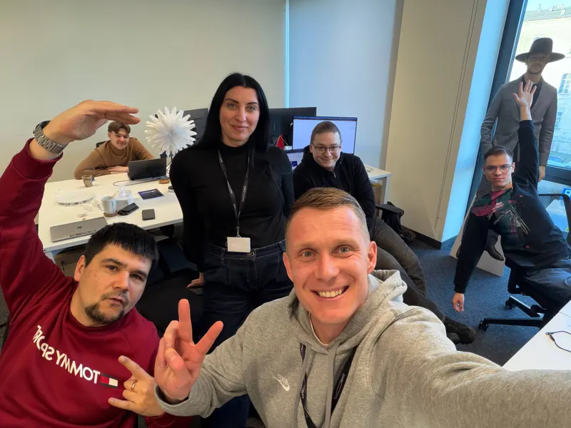 Office selfie with teammates at their desks
