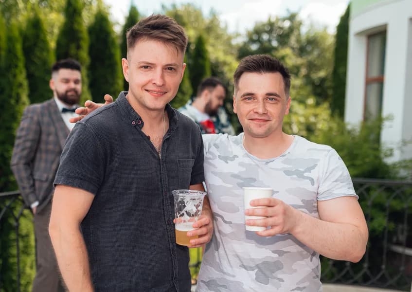 Two teammates at a summer garden party