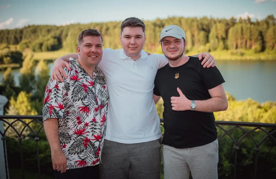 Three teammates at the summer lake retreat