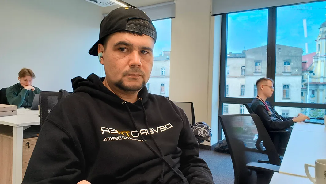 Engineer in a DevBrother hoodie at the office